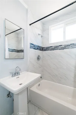 a bathroom with a sink and a bathtub