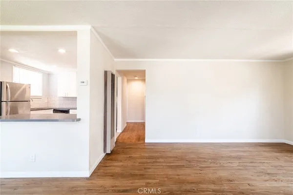 a view of a kitchen from the hallway