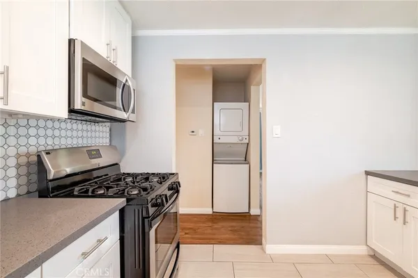 a kitchen with a stove and a microwave