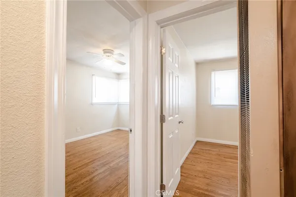 a view of a bathroom from a hallway