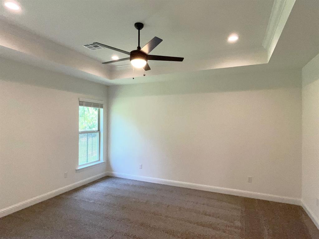 159 Lessie Drive Stonewall, LA 71078 - Photo 16 of 26 an empty room with a window and a fan