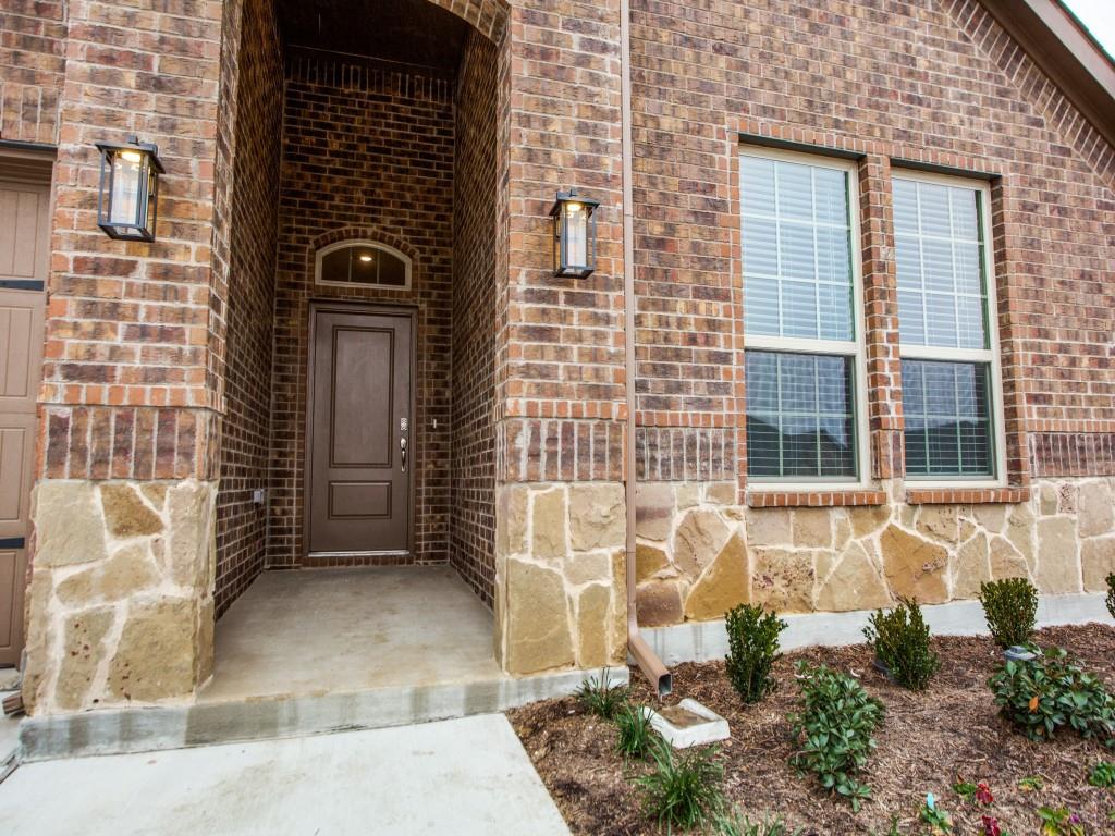 123 Lakeview Circle Pilot Point, TX 76258 - Photo 6 of 39 a view of a brick house with a window