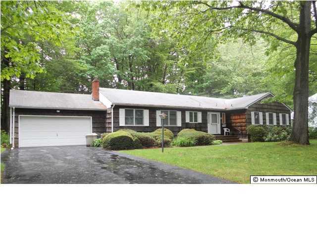 25 Kettle Creek Road Freehold, NJ 07728 - Photo 1 of 3 a view of a yard in front of a house