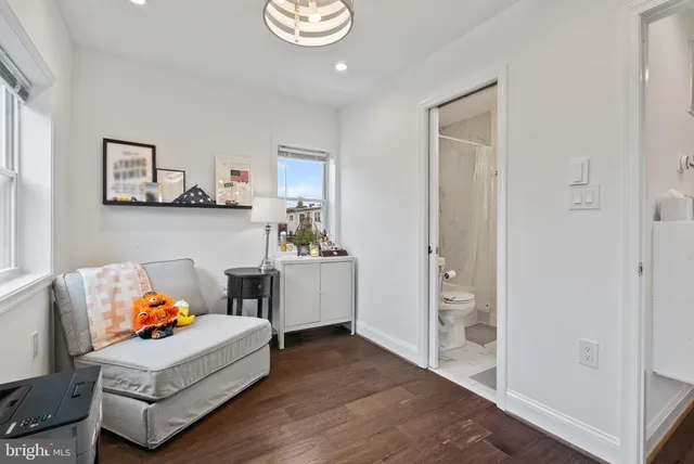 a bed room with furniture and a window