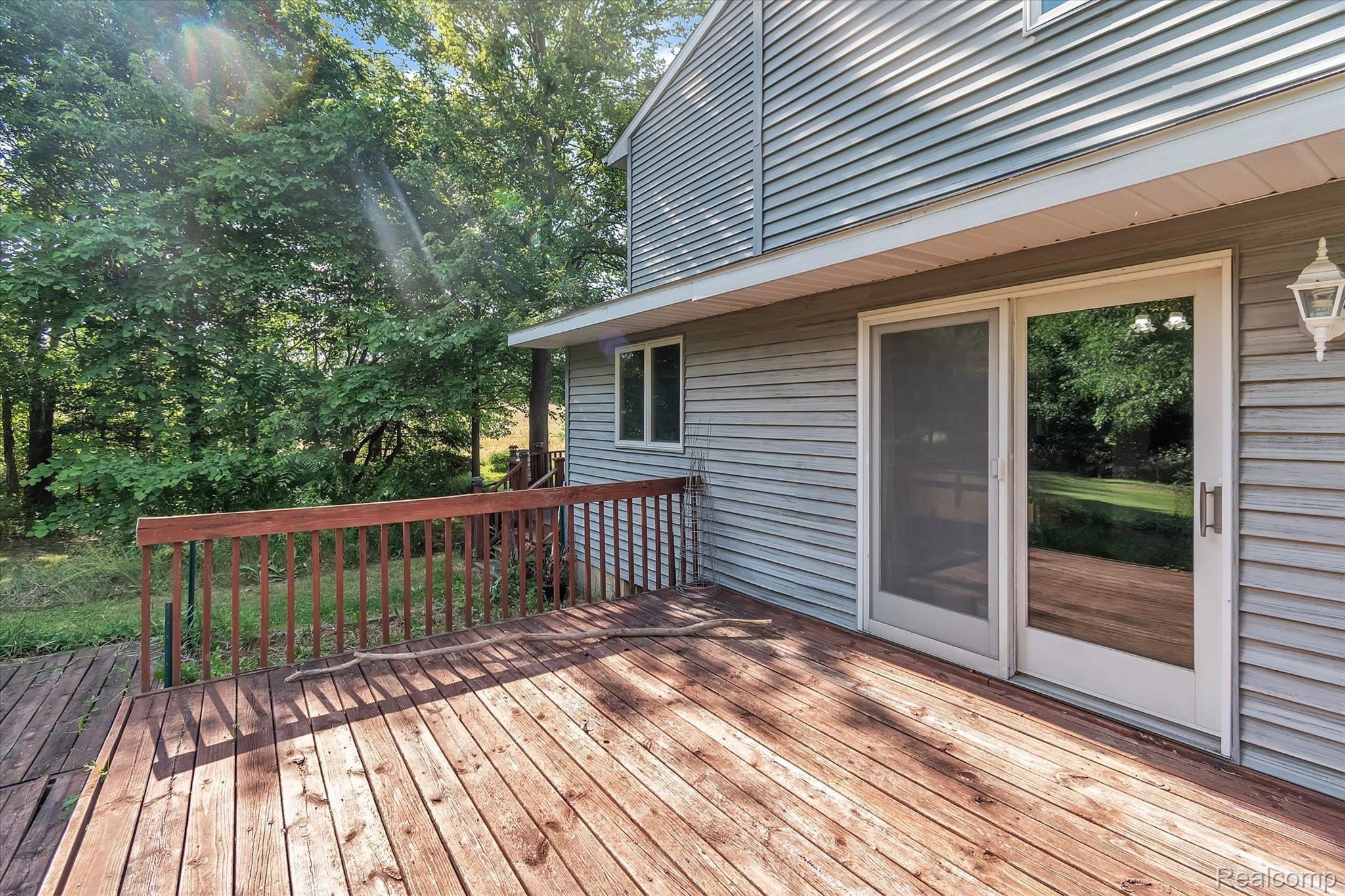 11174 Sharp Road Linden, MI 48451 - Photo 44 of 54 44 11174 Sharp - side yard deck.jpg
