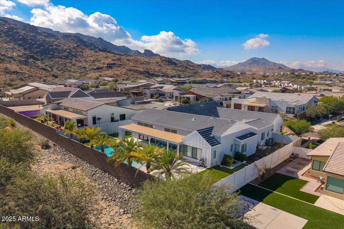 9407 South 13th Way Phoenix, AZ 85042 - Photo 16 of 33 aerial view of a house with a mountain