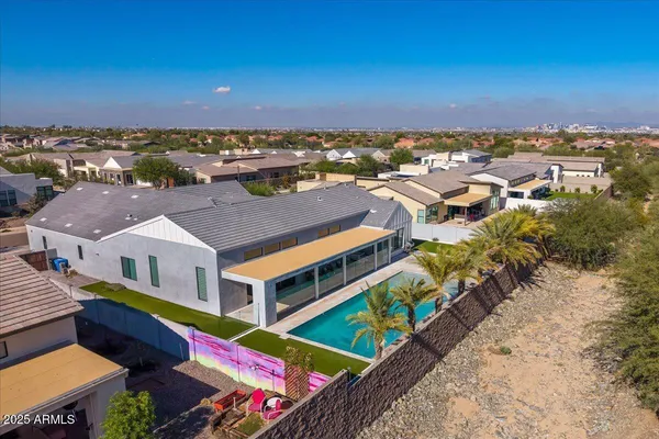 aerial view of a house with a mountain