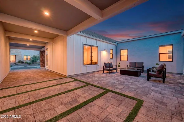an aerial view of a house with a garden and plants