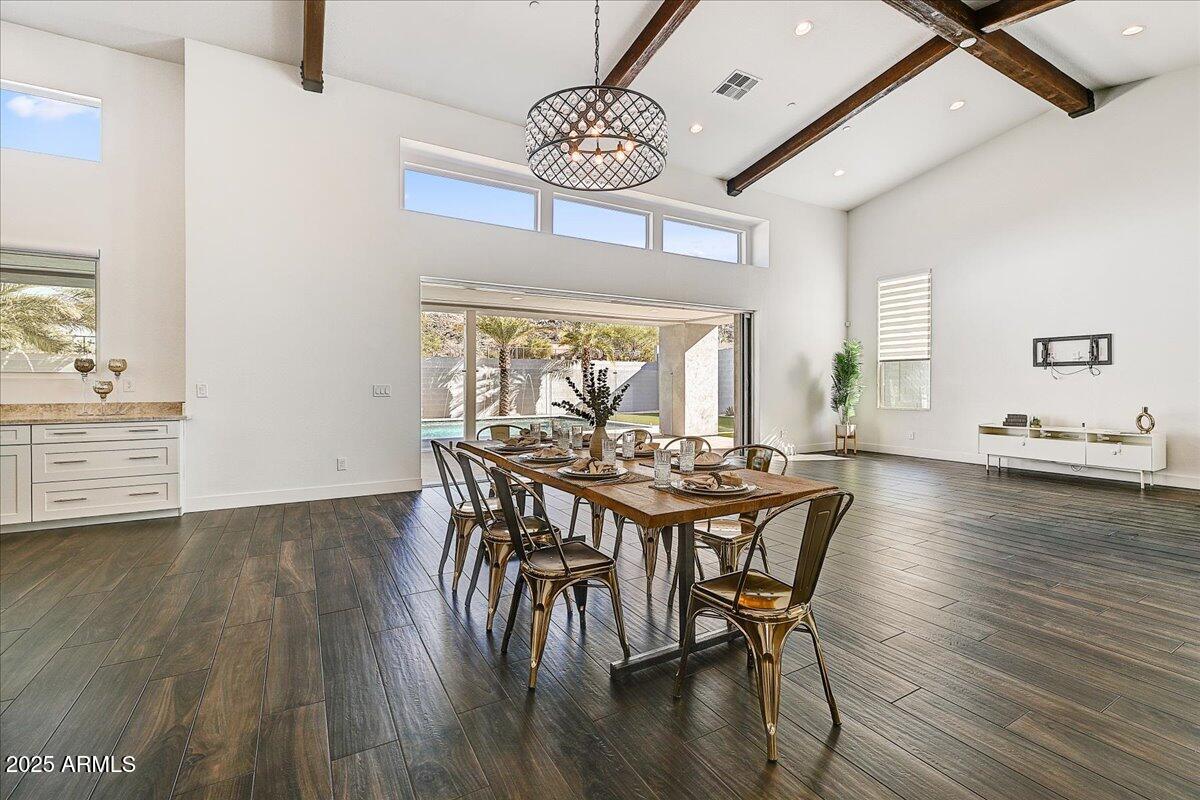 9407 South 13th Way Phoenix, AZ 85042 - Photo 25 of 33 a view of a dining room with furniture and wooden floor