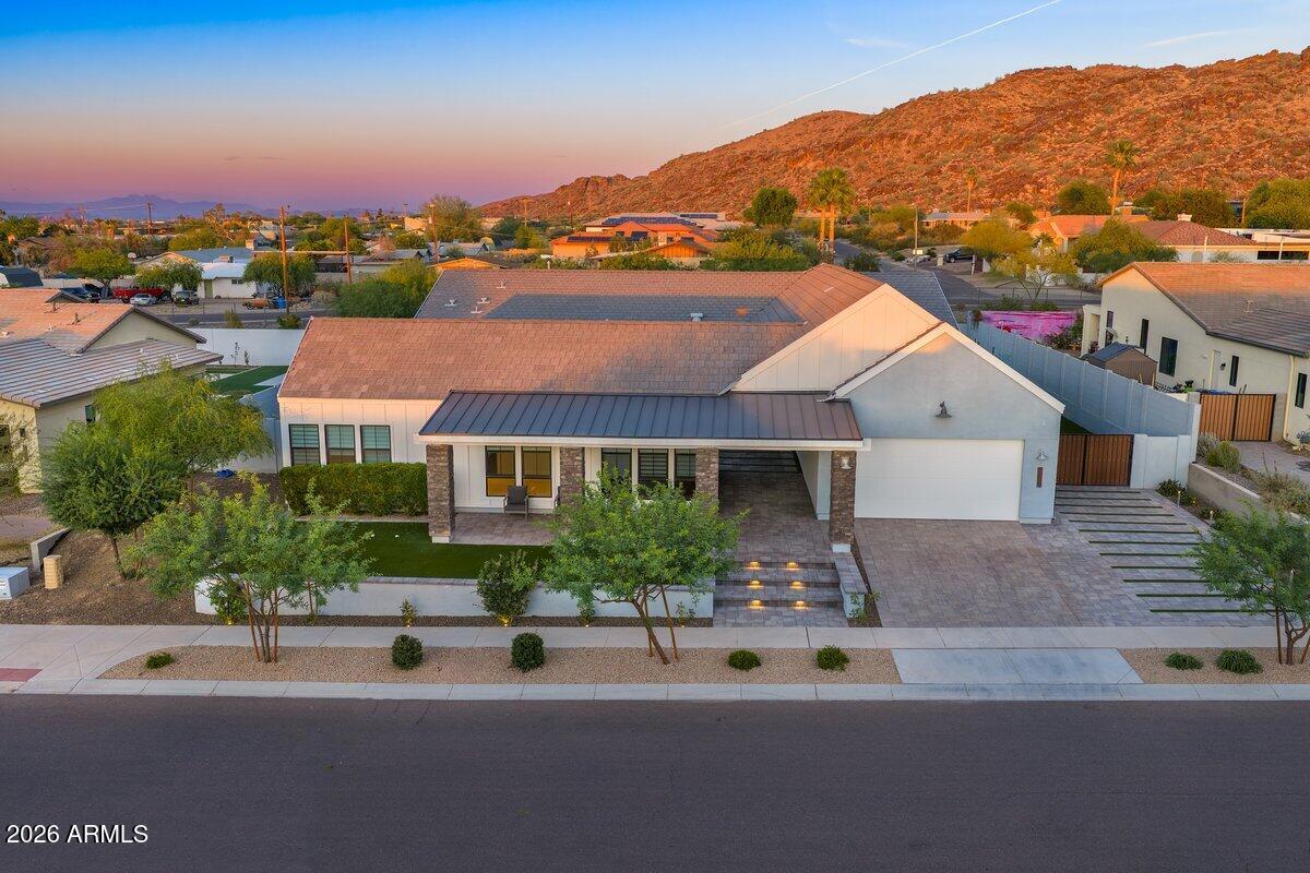 9407 South 13th Way Phoenix, AZ 85042 - Photo 28 of 51 a front view of house with a garden and balcony