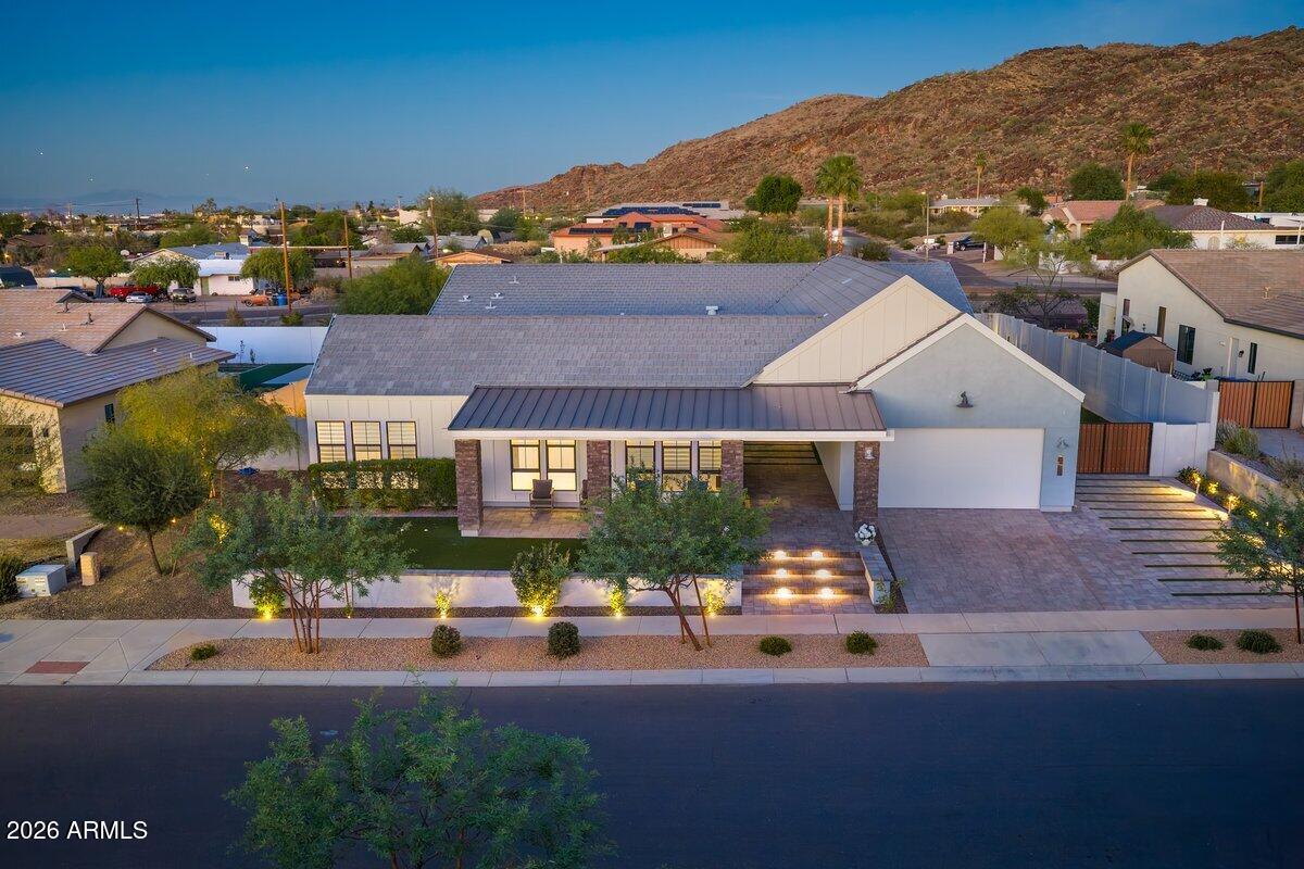 9407 South 13th Way Phoenix, AZ 85042 - Photo 36 of 51 an aerial view of a house with a garden and lake view