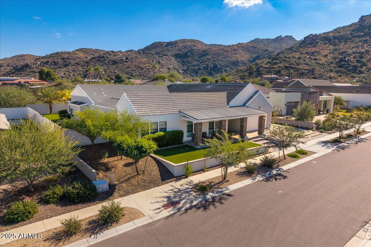 9407 South 13th Way Phoenix, AZ 85042 - Photo 5 of 51 an aerial view of a house with a garden