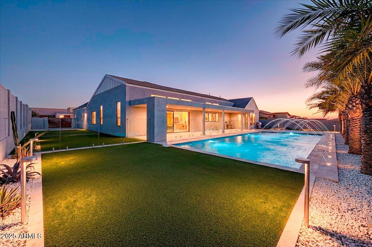 9407 South 13th Way Phoenix, AZ 85042 - Photo 7 of 33 a view of a house with swimming pool