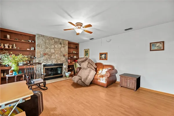 a bed room with furniture and a fireplace