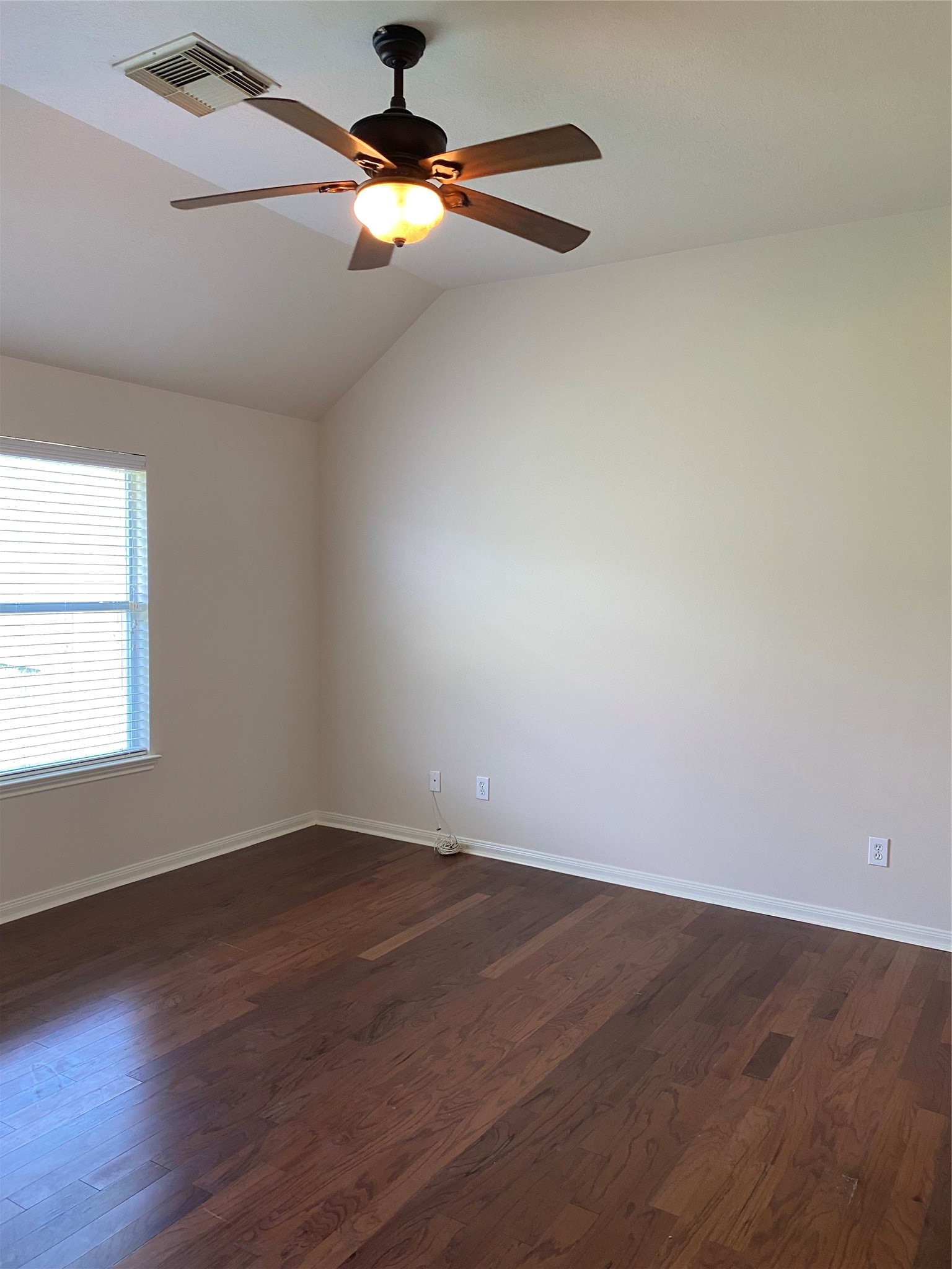 25119 Hazel Ranch Drive Katy, TX 77494 - Photo 12 of 18 Downstairs Primary Bedroom with Laminate Wood Flooring and Ceiling Fan