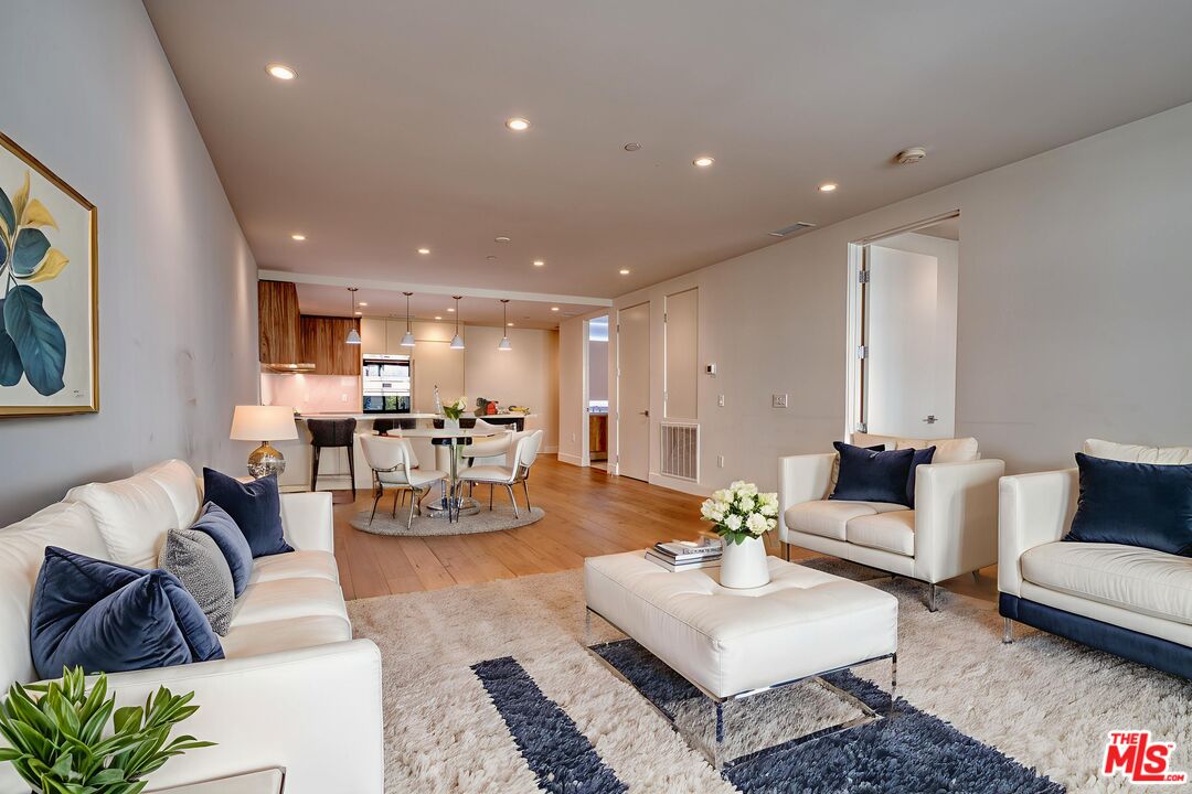 411 South Hamel Road, Unit 306 Los Angeles, CA 90048 - Photo 11 of 40 a living room with furniture and kitchen view