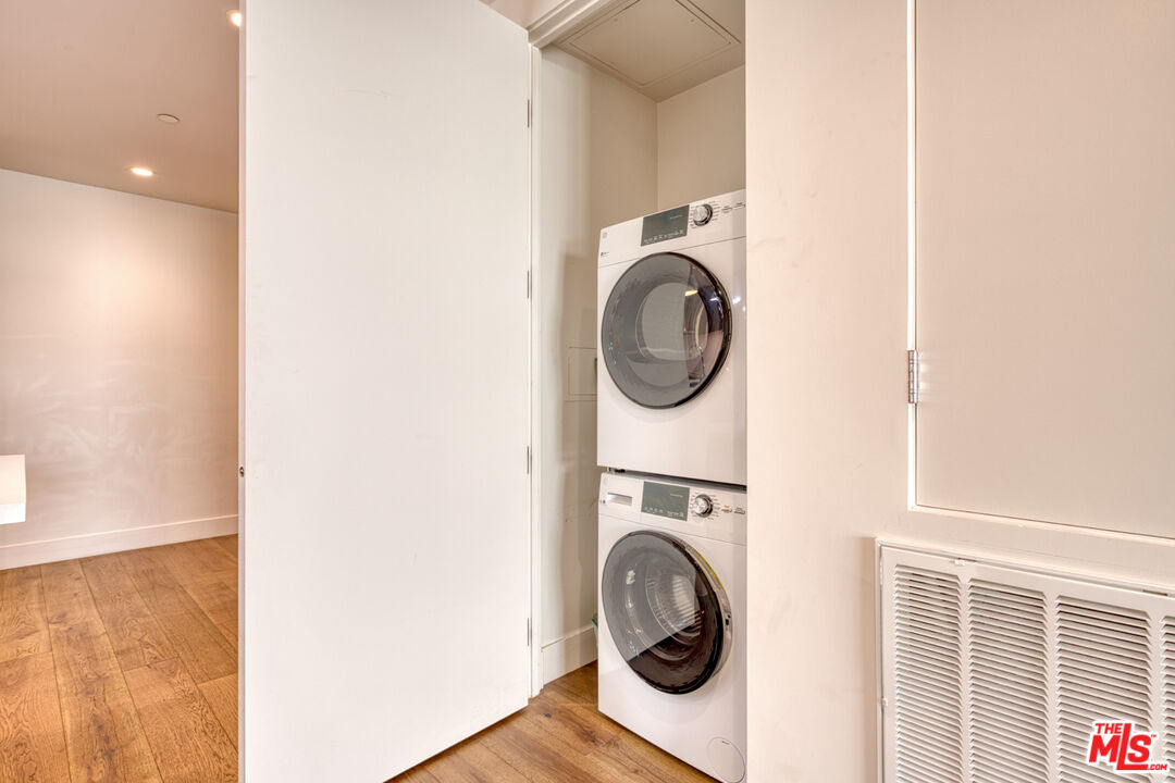 411 South Hamel Road, Unit 306 Los Angeles, CA 90048 - Photo 12 of 40 a view of a hallway with washer and dryer