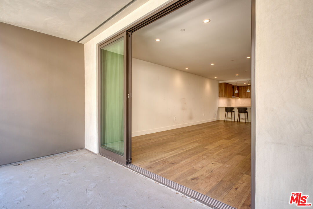 411 South Hamel Road, Unit 306 Los Angeles, CA 90048 - Photo 14 of 40 an empty room with natural light