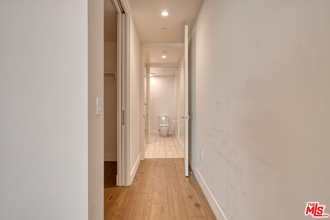 411 South Hamel Road, Unit 306 Los Angeles, CA 90048 - Photo 21 of 40 a view of a bathroom from a hallway