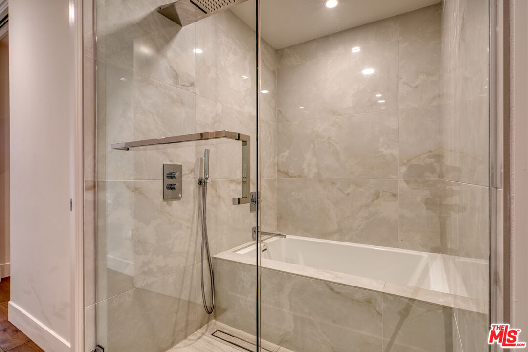 411 South Hamel Road, Unit 306 Los Angeles, CA 90048 - Photo 23 of 40 a bathroom with a glass shower door