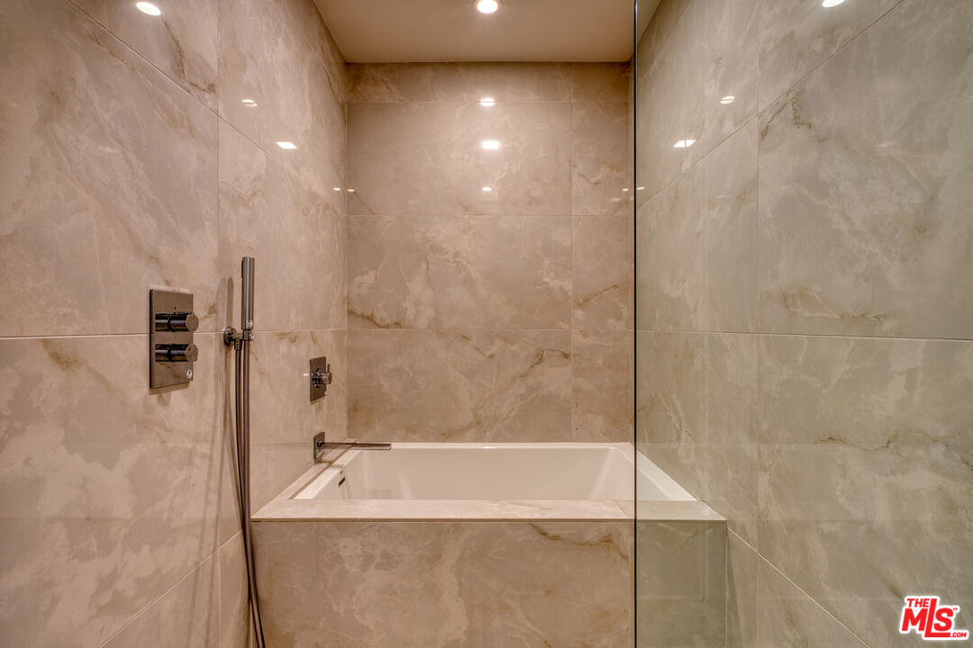 411 South Hamel Road, Unit 306 Los Angeles, CA 90048 - Photo 24 of 40 a bathroom with a tub and a shower
