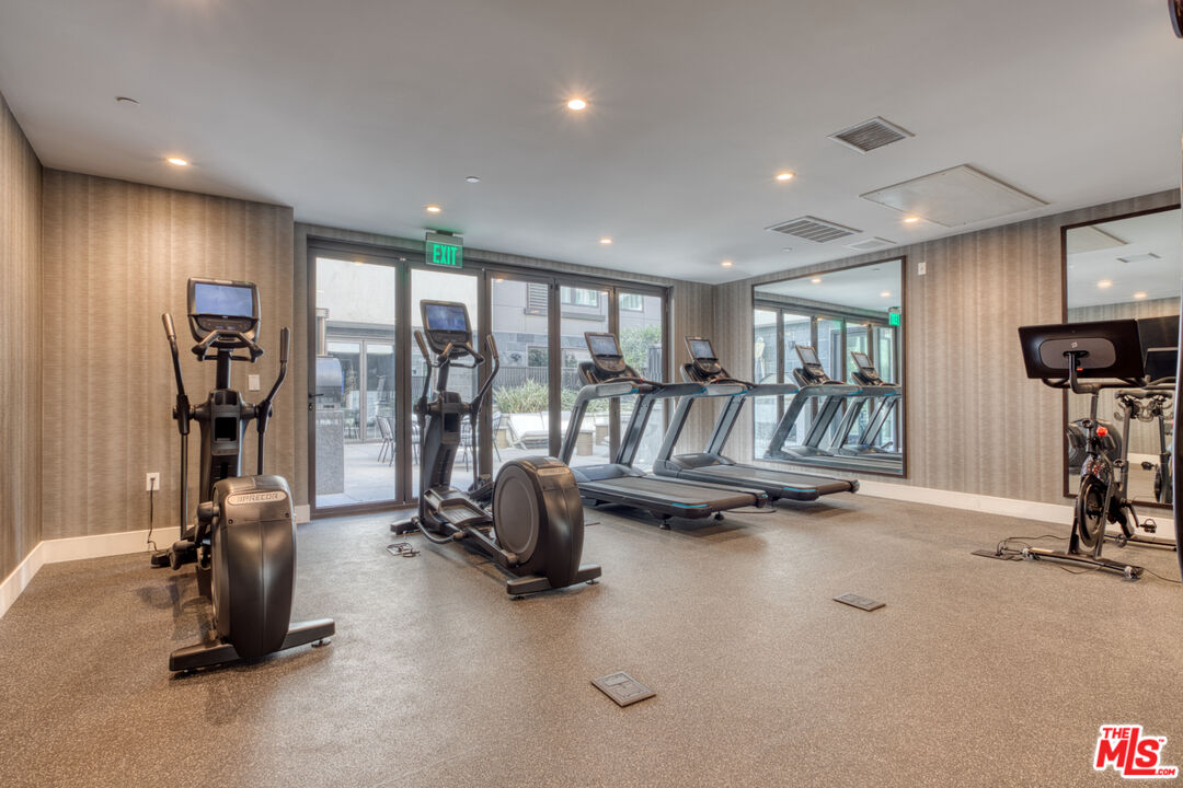 411 South Hamel Road, Unit 306 Los Angeles, CA 90048 - Photo 27 of 40 a view of a room with gym equipment