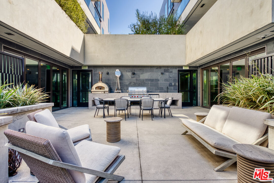 411 South Hamel Road, Unit 306 Los Angeles, CA 90048 - Photo 30 of 40 a building outdoor space with patio furniture