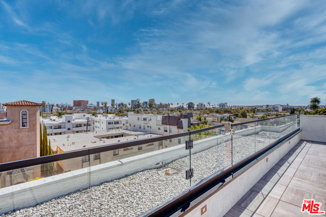411 South Hamel Road, Unit 306 Los Angeles, CA 90048 - Photo 36 of 40 a view of city from a balcony