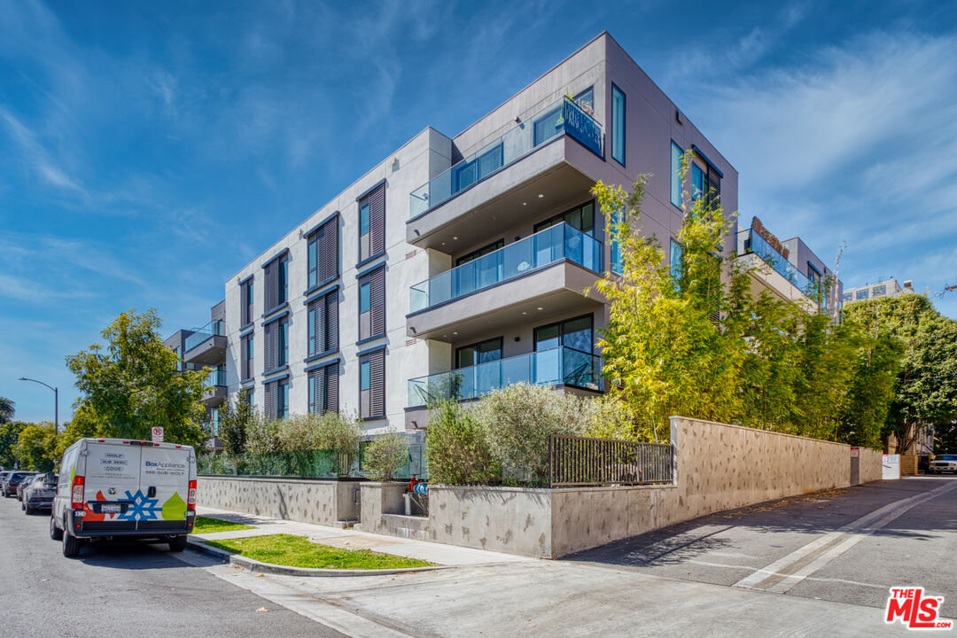 411 South Hamel Road, Unit 306 Los Angeles, CA 90048 - Photo 38 of 40 a view of building with car parked