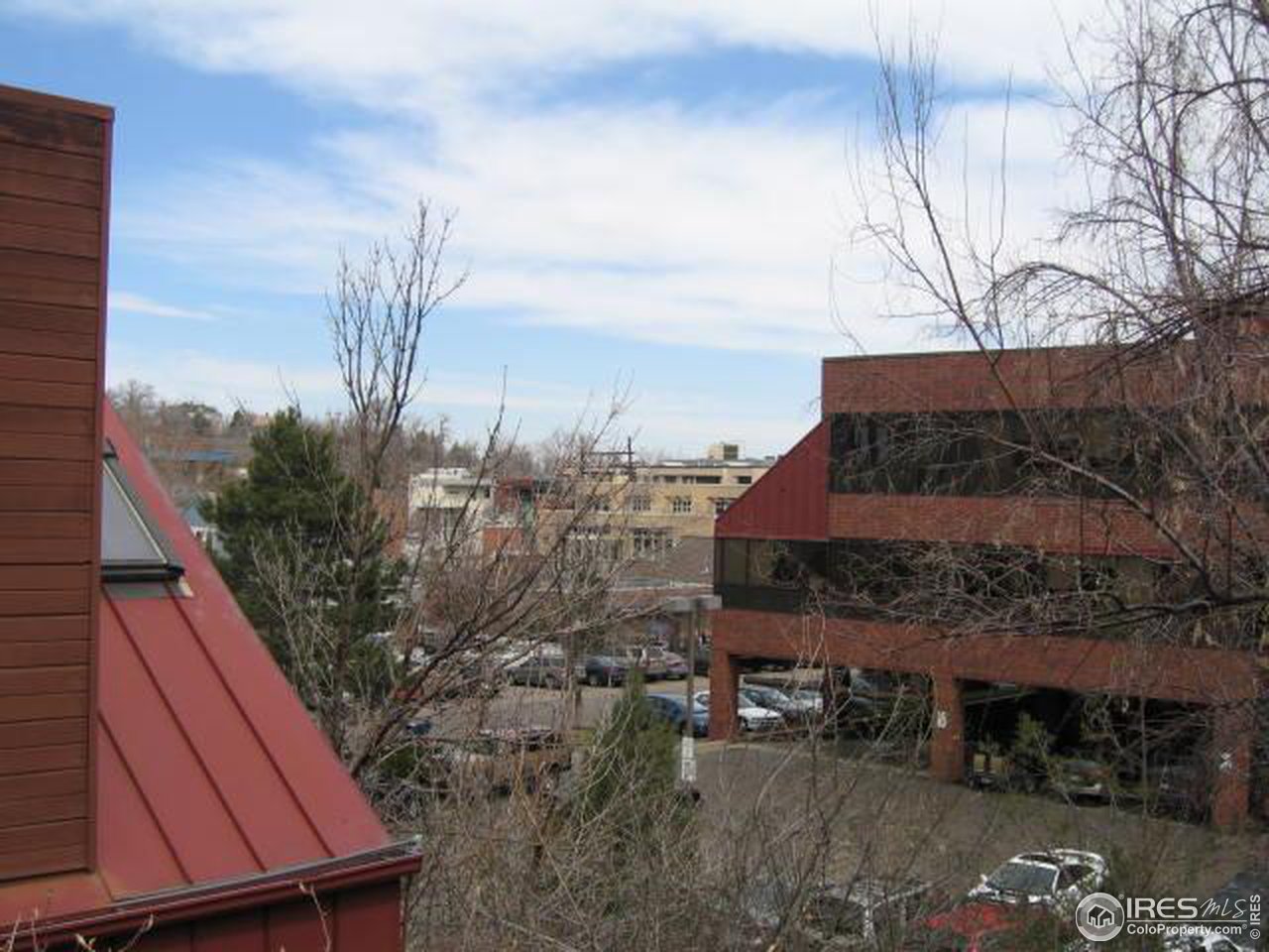 780 Walnut Street, Unit D Boulder, CO 80302 - Photo 14 of 14 a aerial view of a house with a yard and wooden fence