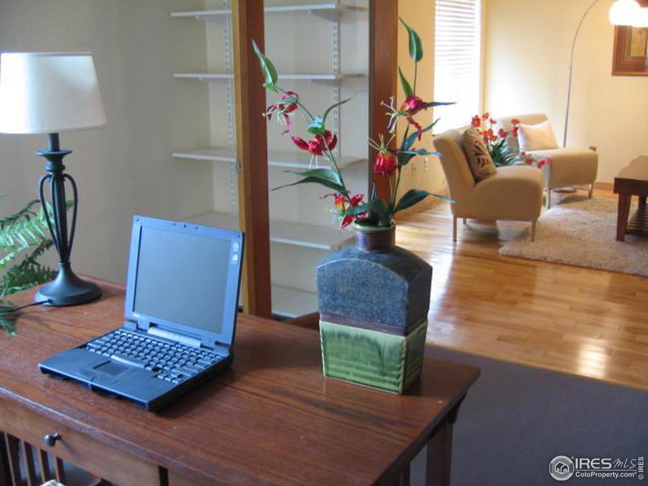 780 Walnut Street, Unit D Boulder, CO 80302 - Photo 9 of 14 a view of a living room with furniture and a window
