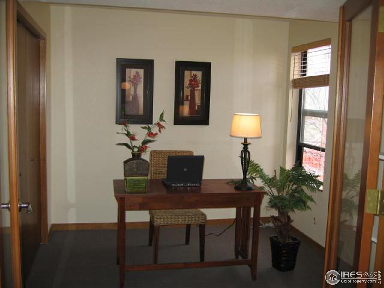 780 Walnut Street, Unit D Boulder, CO 80302 - Photo 10 of 14 a view of a workspace with furniture and a potted plant