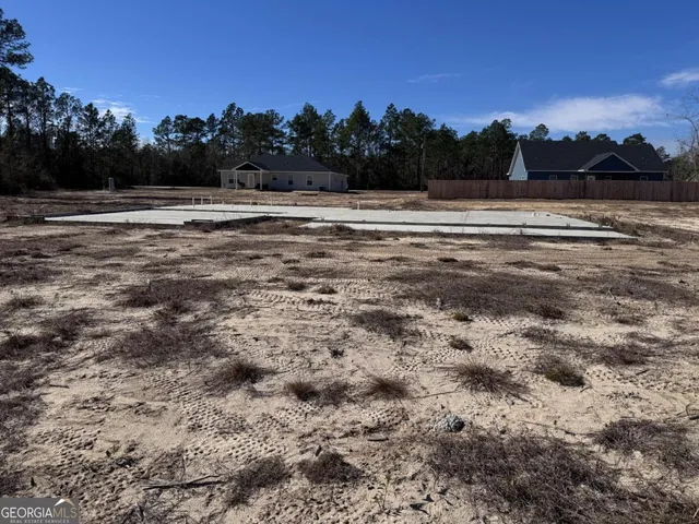 a view of ocean and trees