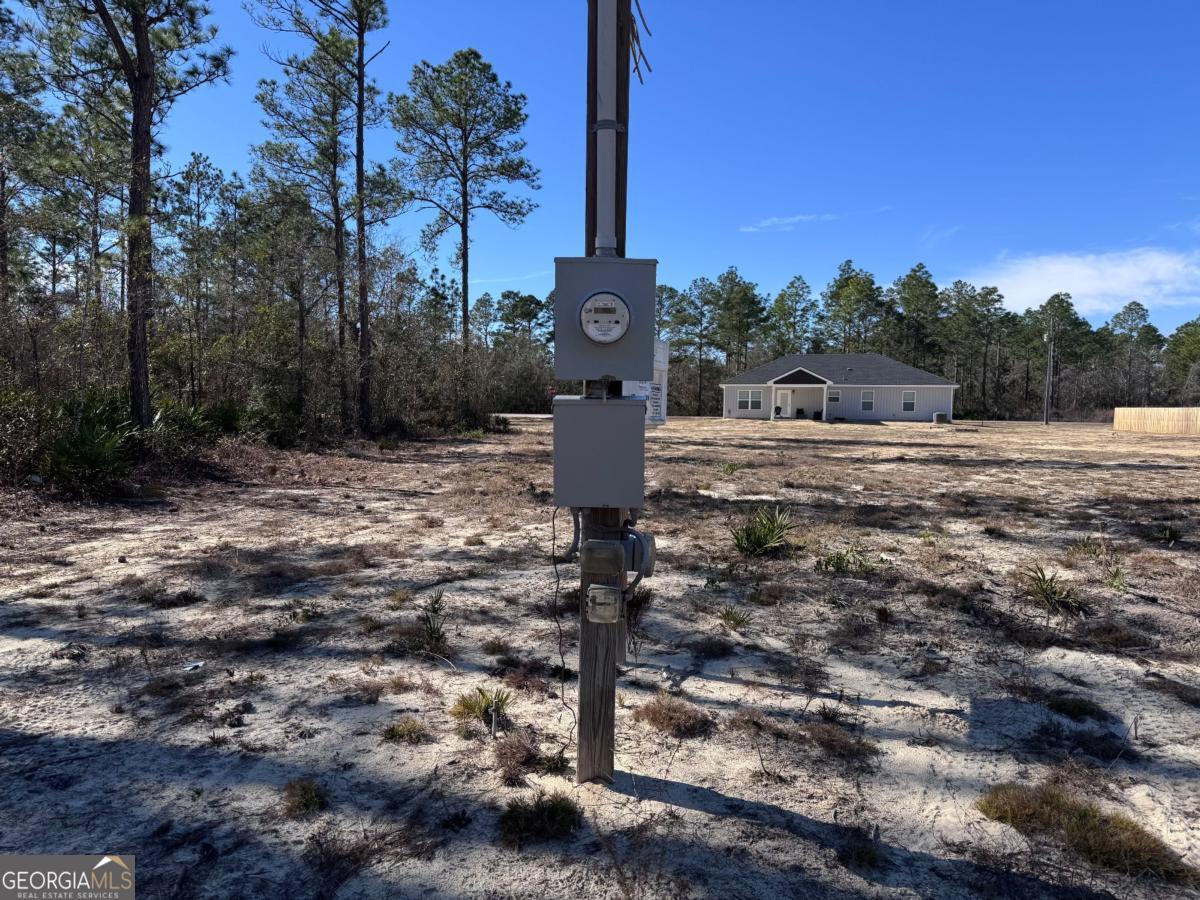 344 Jekyll Island Road Jesup, GA 31545 - Photo 4 of 11 a view of a water fountain with large trees