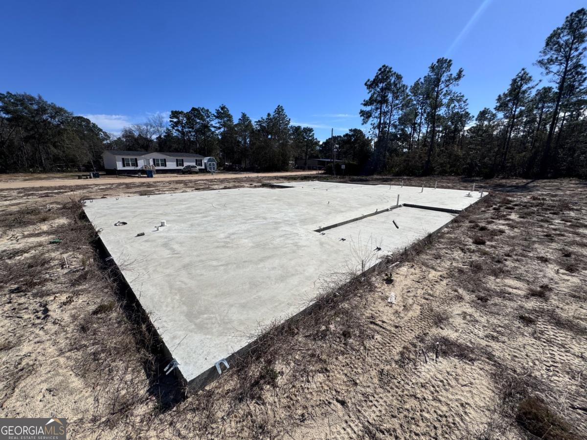 344 Jekyll Island Road Jesup, GA 31545 - Photo 6 of 11 a view of a yard with wooden fence