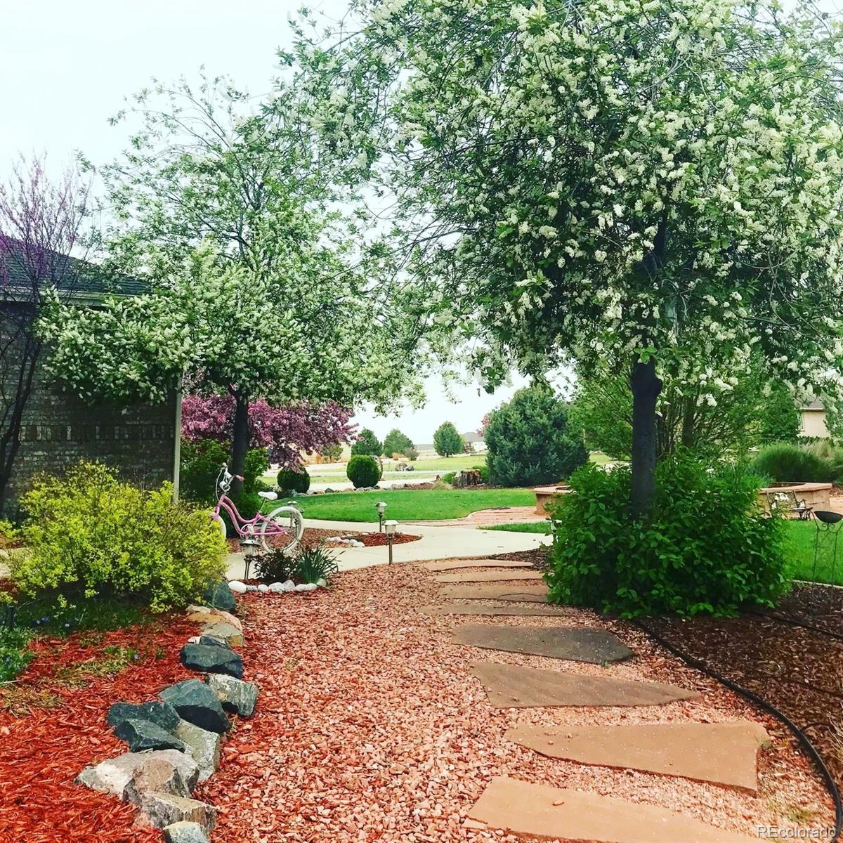 16504 Badminton Road North Platteville, CO 80651 - Photo 2 of 39 a view of a pathway with a yard