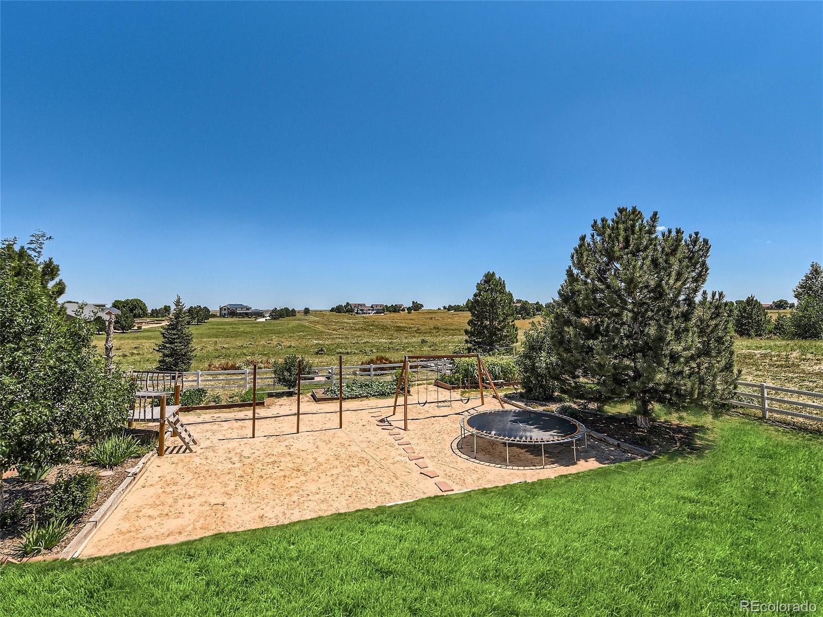 16504 Badminton Road North Platteville, CO 80651 - Photo 38 of 39 a view of a backyard with a garden