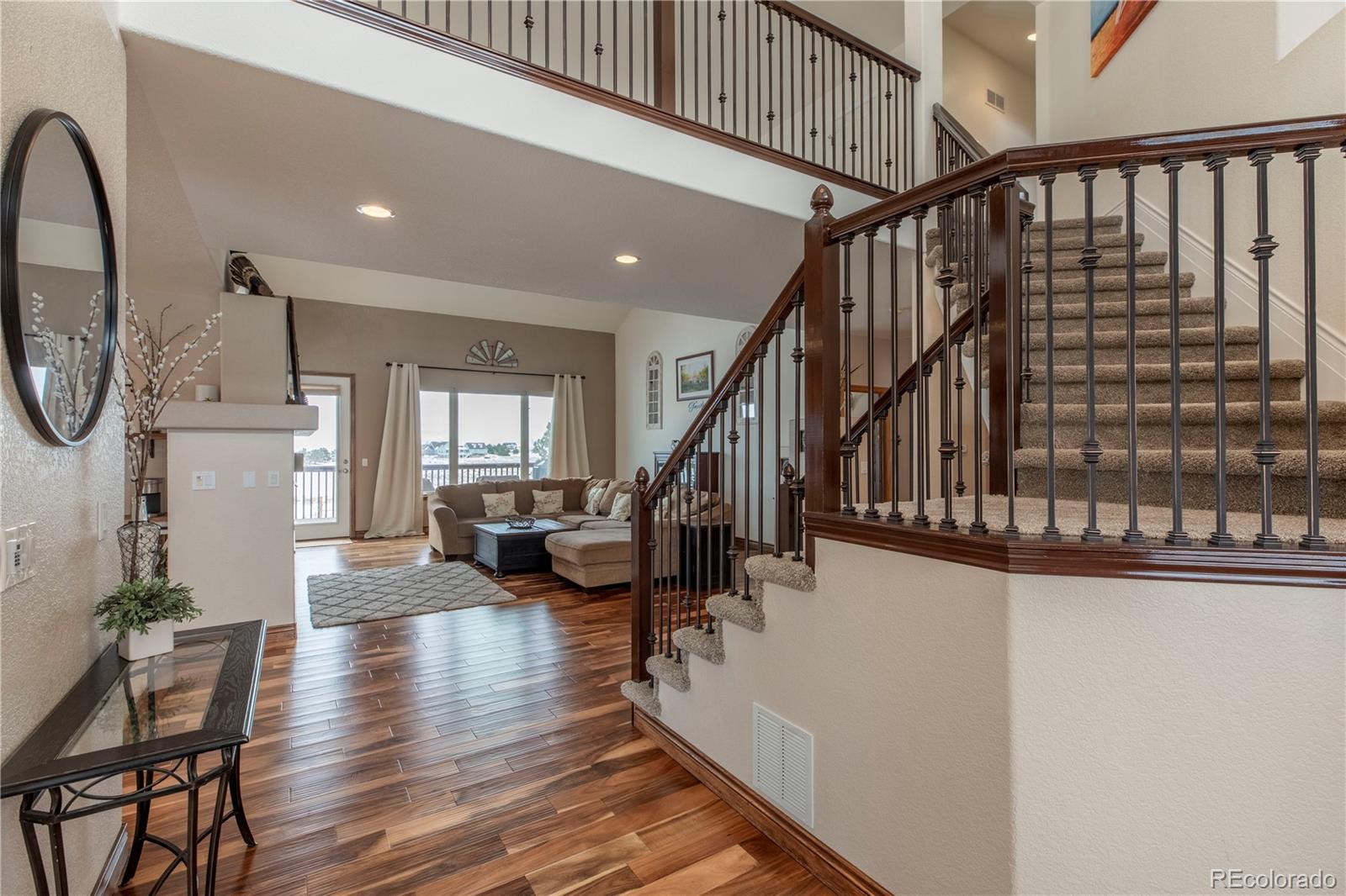 16504 Badminton Road North Platteville, CO 80651 - Photo 5 of 39 a view of entryway and hall with wooden floor