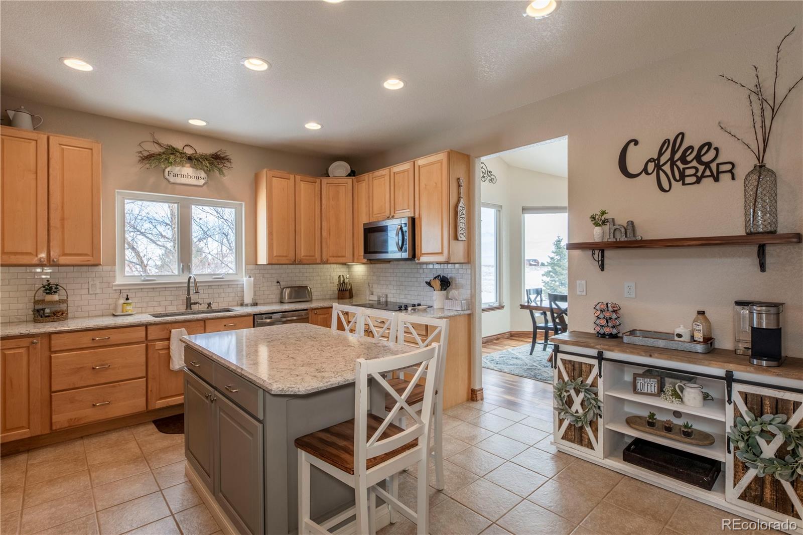 16504 Badminton Road North Platteville, CO 80651 - Photo 8 of 39 a kitchen with appliances a sink and cabinets