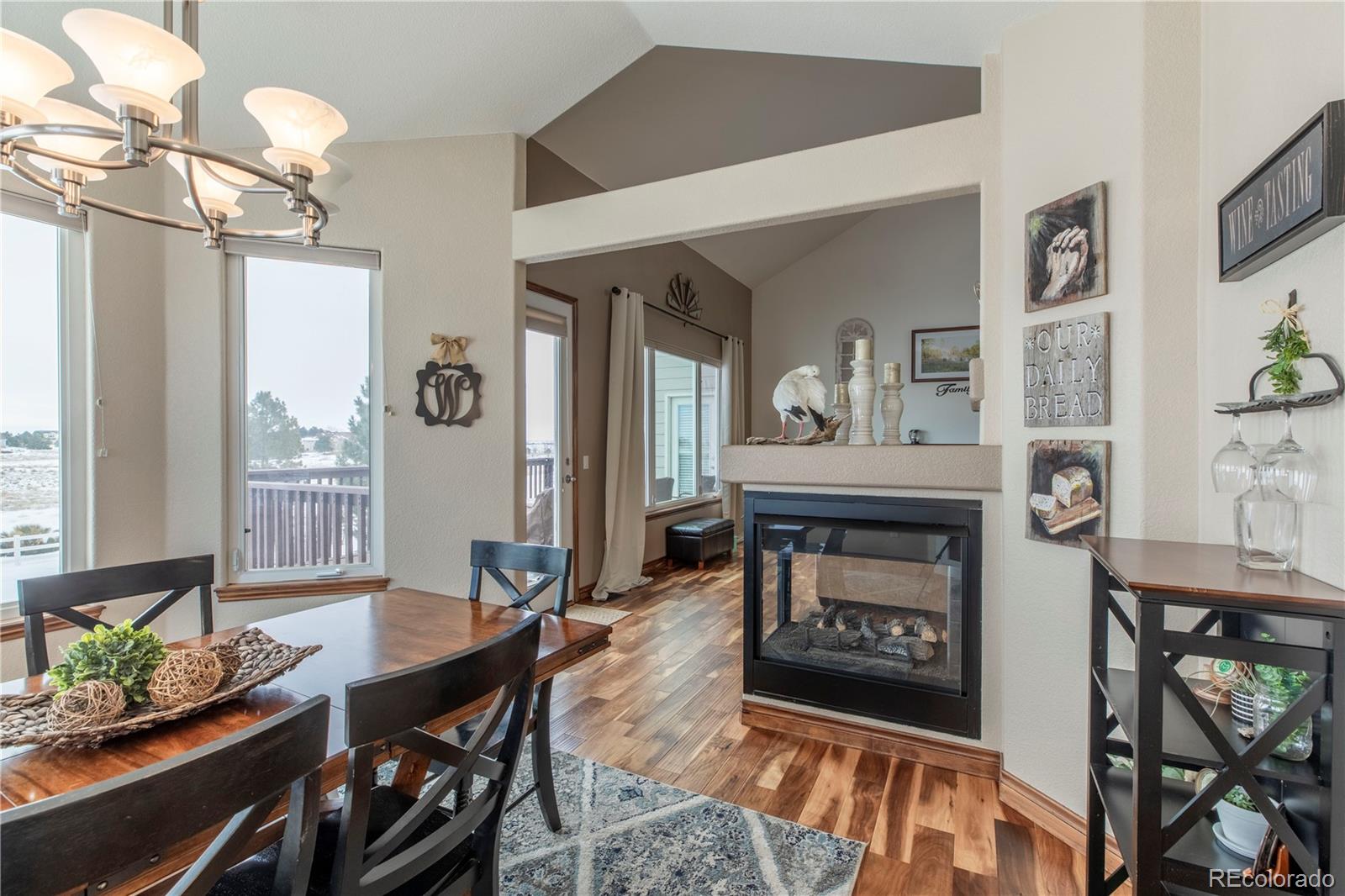 16504 Badminton Road North Platteville, CO 80651 - Photo 9 of 39 a living room with furniture and a fireplace