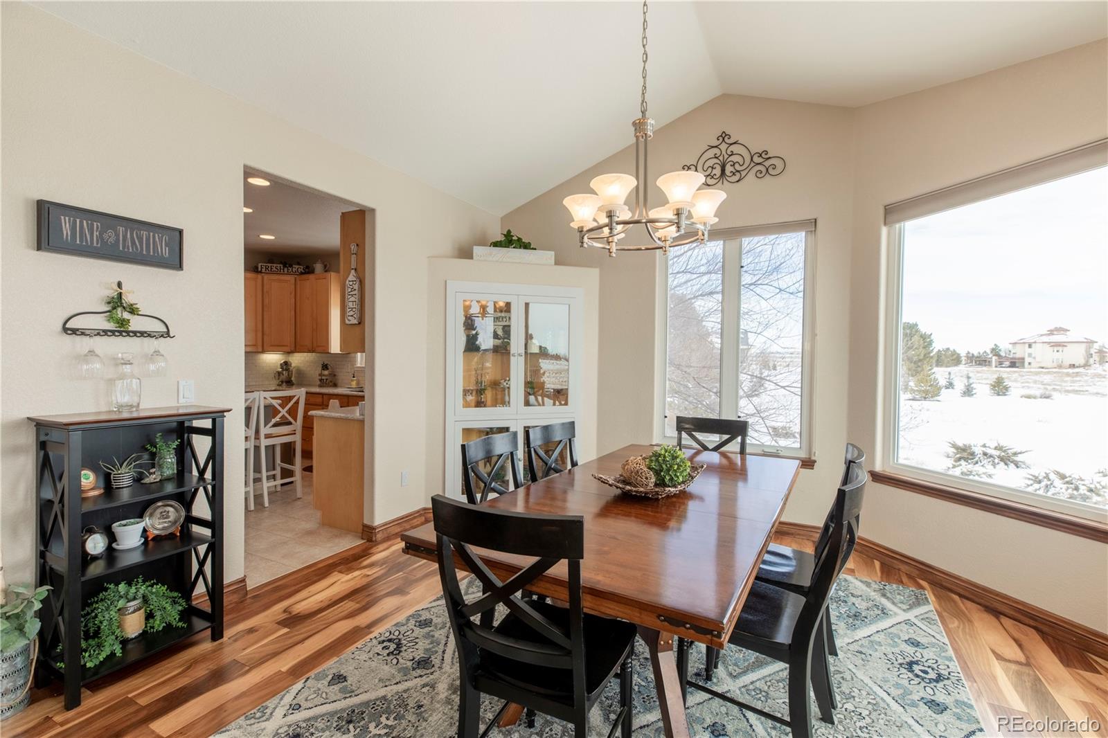16504 Badminton Road North Platteville, CO 80651 - Photo 10 of 39 a view of a dining room with furniture window and wooden floor