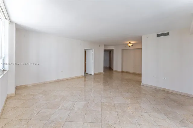 a kitchen with granite countertop a sink and a stove top oven
