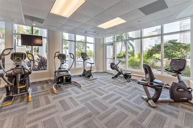 a view of swimming pool with outdoor seating and lake view