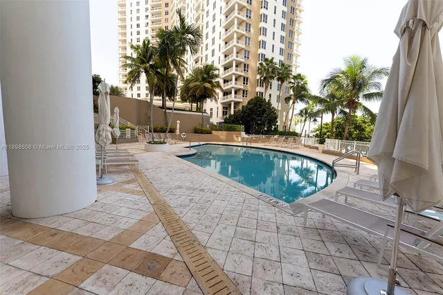 a view of a swimming pool with a patio