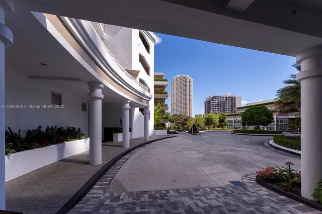 a lobby with furniture and a rug
