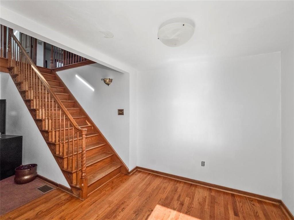 29 Profio Road McDonald, PA 15057 - Photo 13 of 44 a view of a hallway with wooden floor and staircase