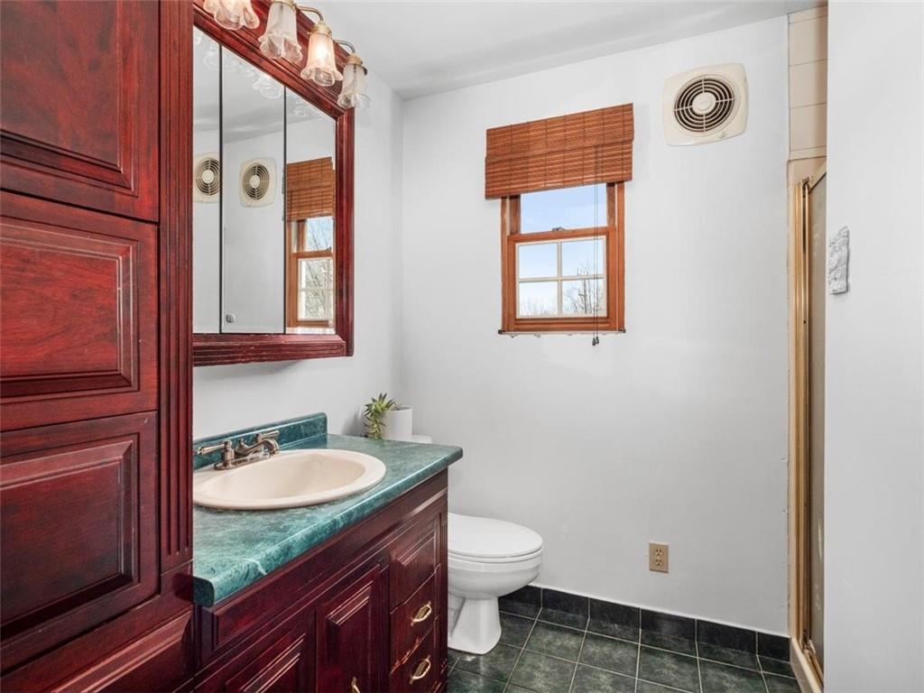 29 Profio Road McDonald, PA 15057 - Photo 22 of 44 a bathroom with a granite countertop sink toilet and mirror
