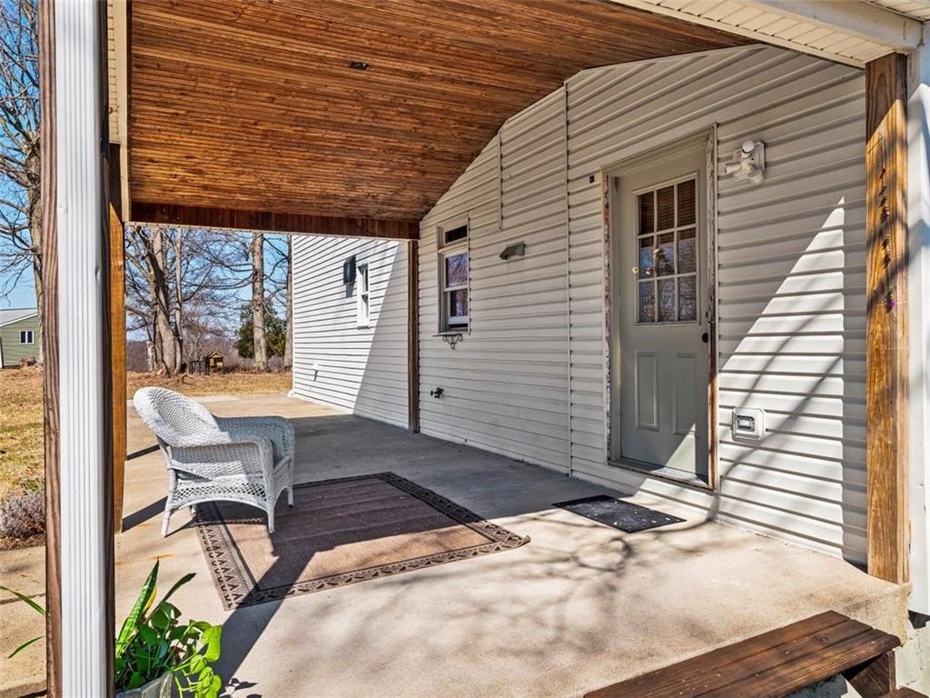29 Profio Road McDonald, PA 15057 - Photo 25 of 44 a view of a patio with table and chairs with wooden floor and fence