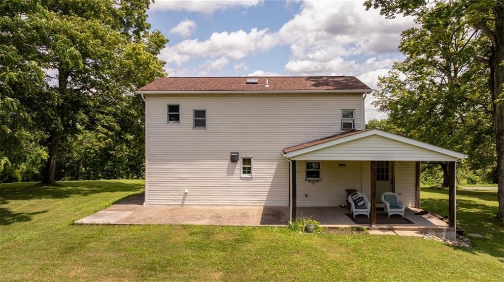 29 Profio Road McDonald, PA 15057 - Photo 33 of 44 a front view of a house with a yard table and chairs