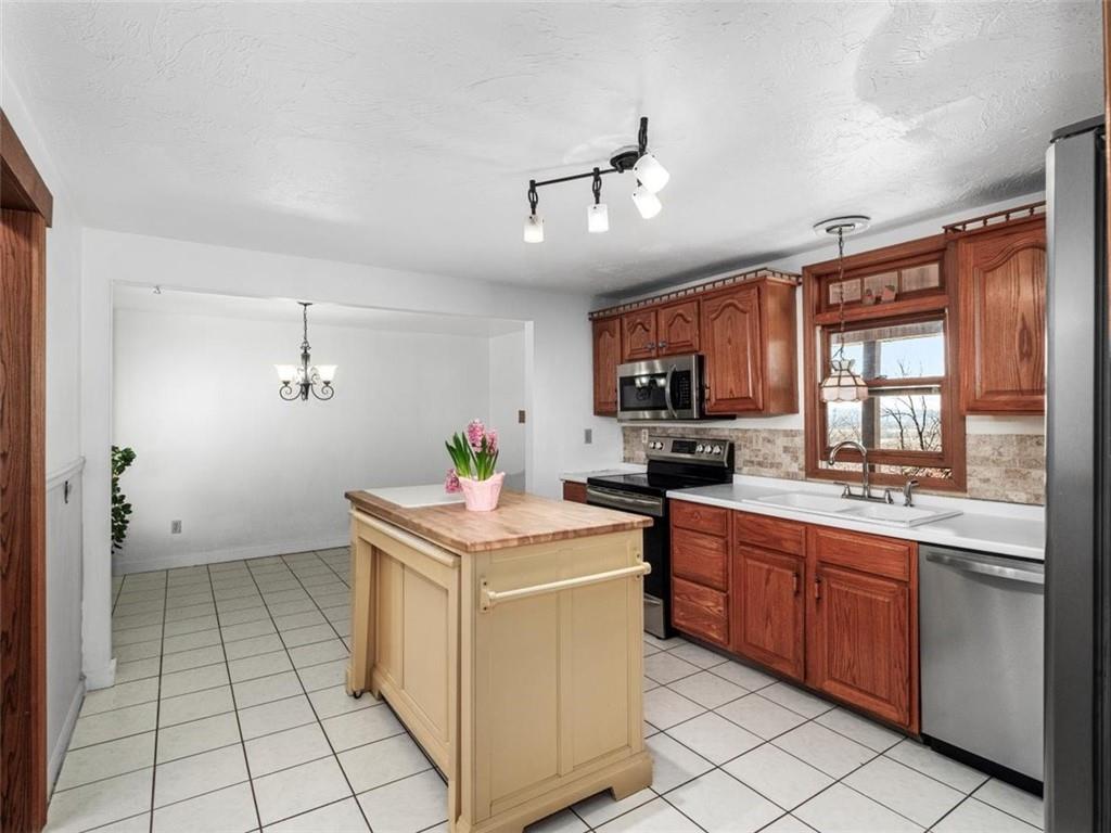 29 Profio Road McDonald, PA 15057 - Photo 8 of 44 a kitchen with a stove sink and cabinets